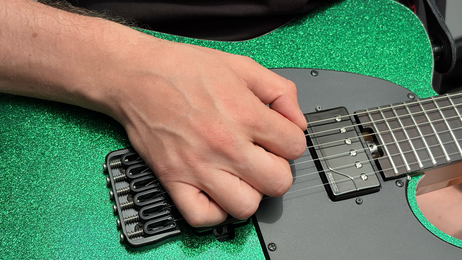 Picking hand position for palm muting near the bridge