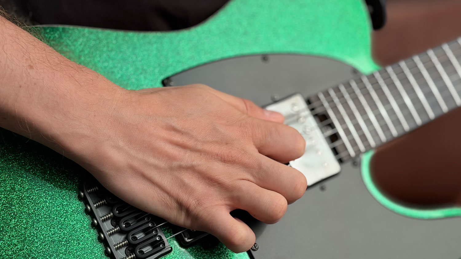 Picking hand pressing too hard into the bridge