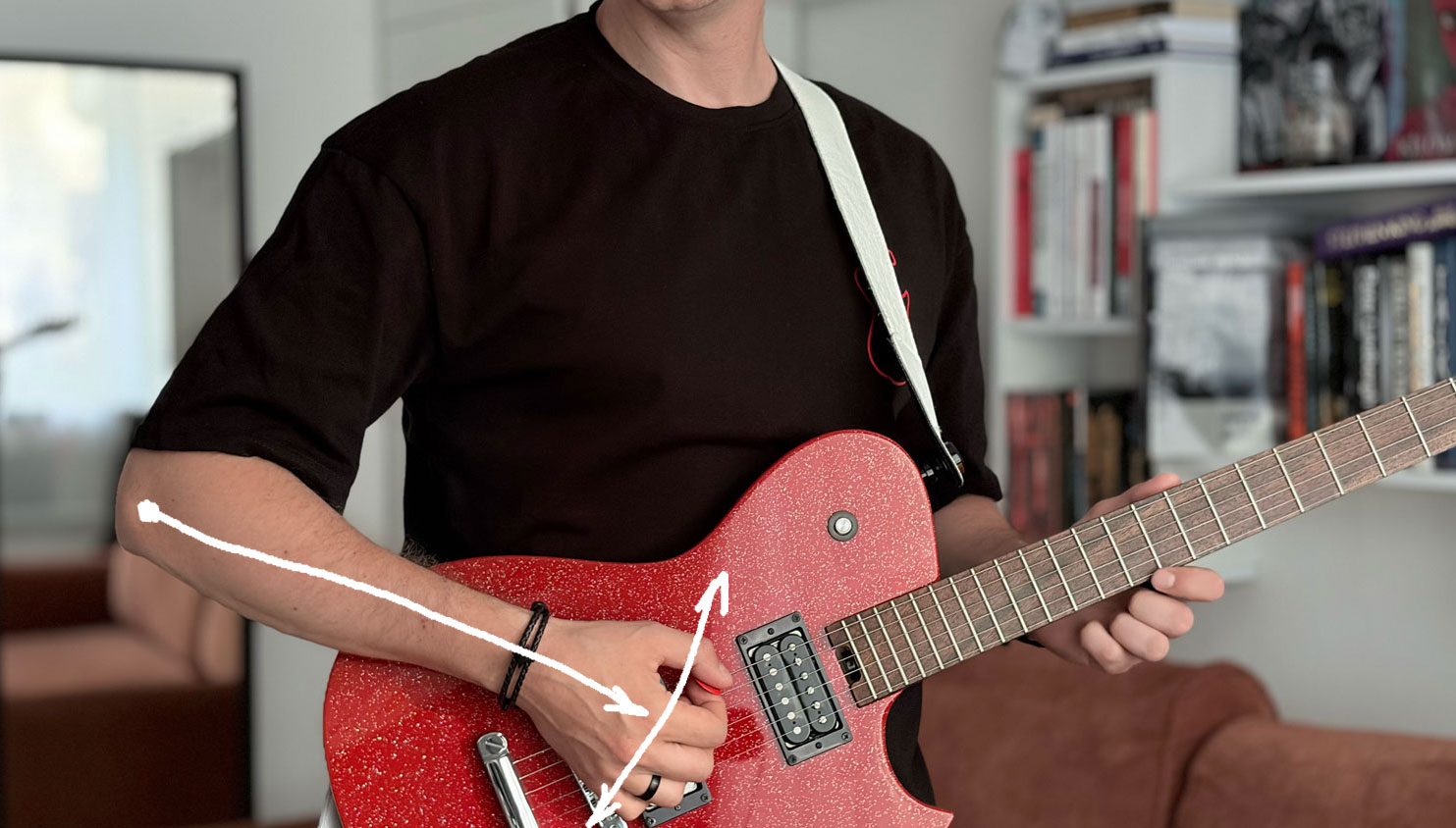 Elbow movement used during guitar picking