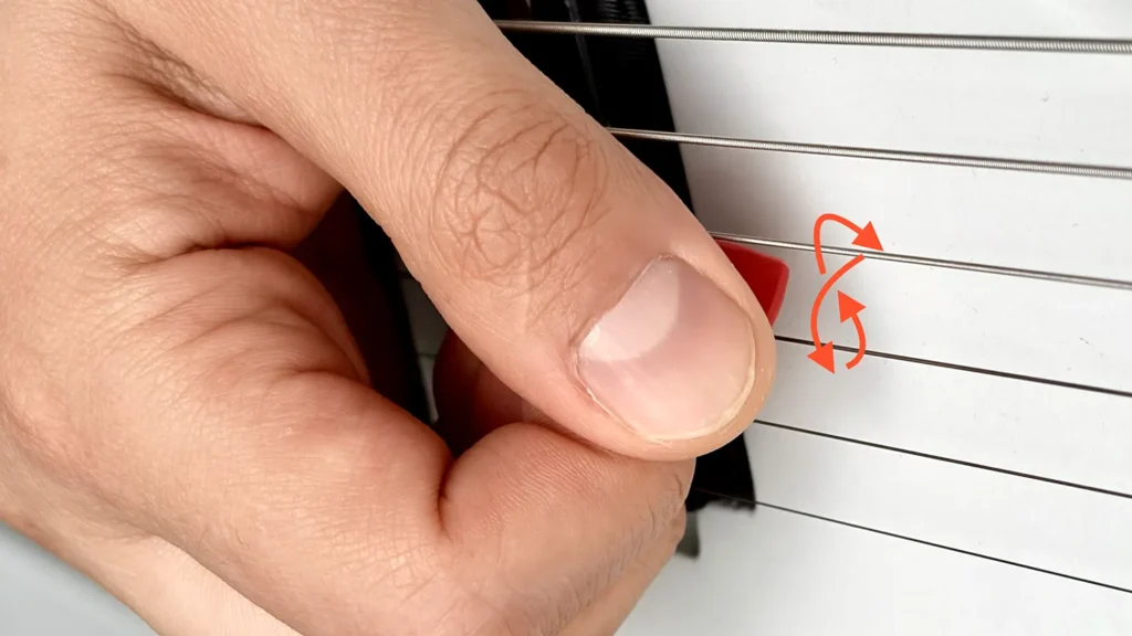 Picking hand movement during an alternate picking string change